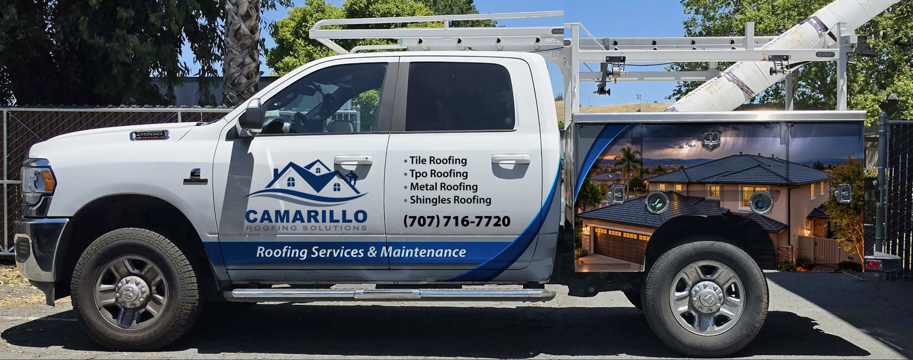 Camarillo Roofing Solution work truck with blue stripe and roofing services lettering