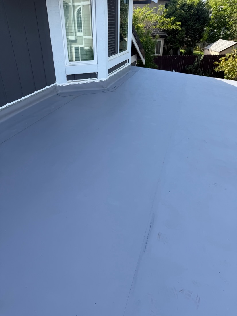 Bright white TPO membrane on a low-slope roof