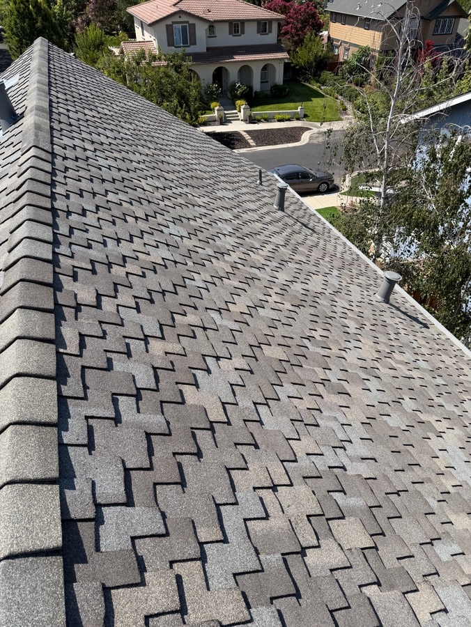 Straight shingle rows along a steep roof